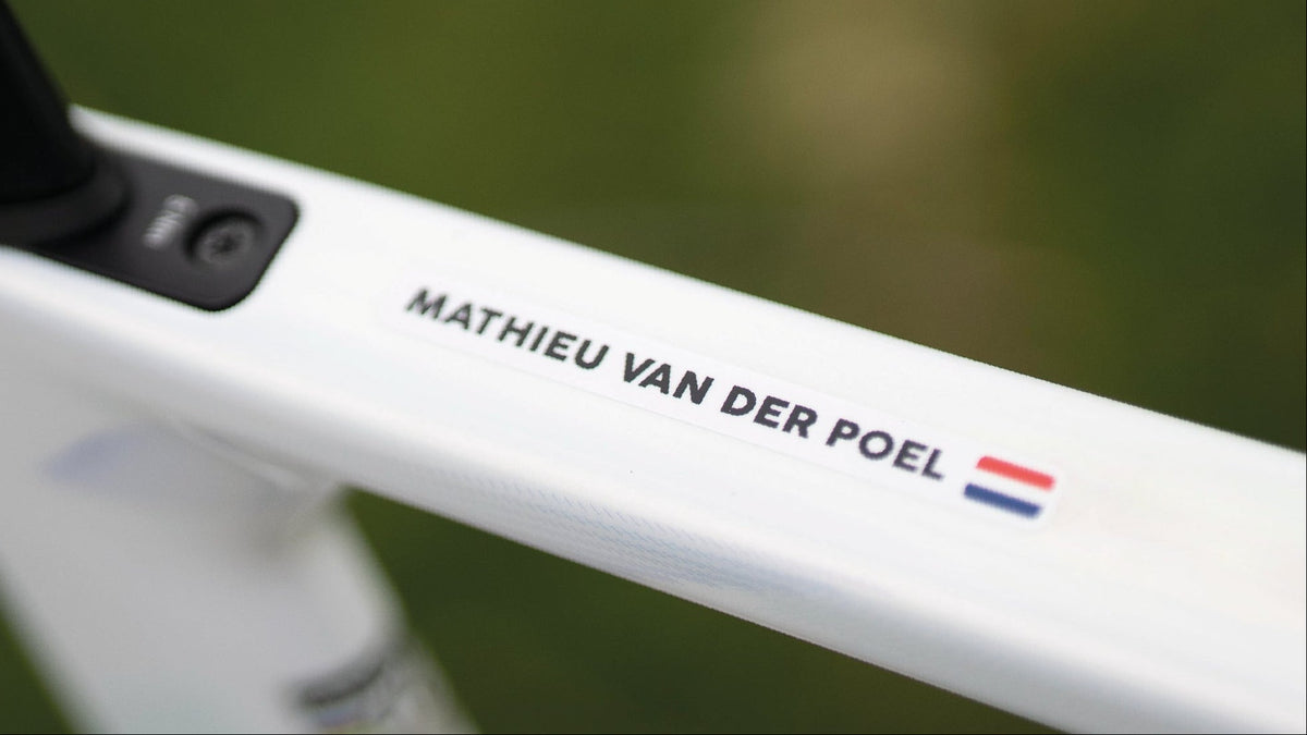 Mathieu van der Poel’s name sticker with the Dutch flag on the white top tube of his road bike