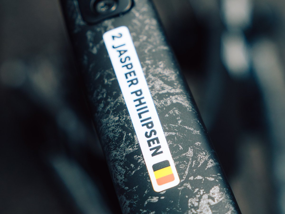 Jasper Philipsen’s name sticker with the Belgian flag on the frame of his road bike