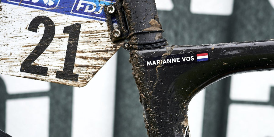 Marianne Vos’s name sticker on her mud-covered bike after Paris-Roubaix