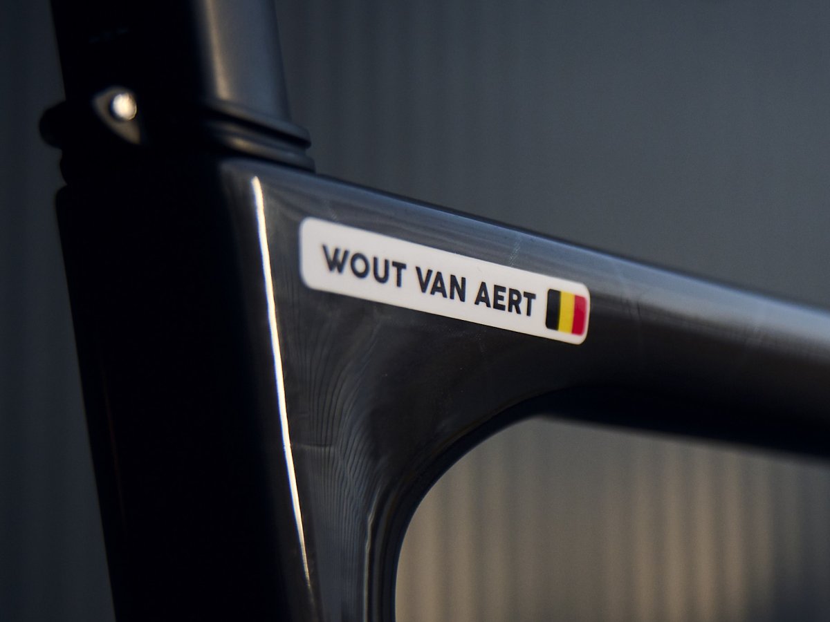 Wout van Aert’s name sticker with the Belgian flag on the top tube of his road bike
